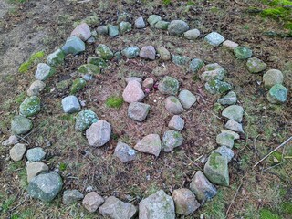 spiral of stones in the forest at daytime