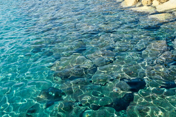 Blue sea water and white rocks