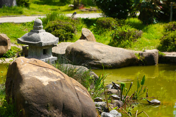 Park with lake pond in Japanese style, Asian culture. Calming landscape