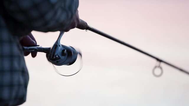 closeup of fishing rod at sunset