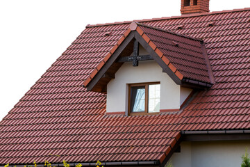 Modern roof with stylish small brown window.