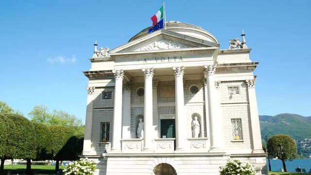 Tour around the facade of the famous "Tempio Voltiano" (meaning: Alessandro Volta's temple), Como, Italy. Alessandro Volta was an italian scientist. Blue sky on the background.