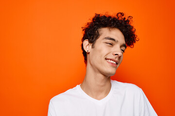 Fototapeta premium Cheerful man curly hair white t-shirt fashion modern style