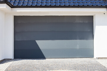 Sectional garage door on white wall