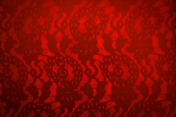 Red lace pattern and tulle design print on red monochrome background with copy space for backdrop, card, paper, invitation, holiday celebration, advertising, etc. Monochromatic seamless fashion print.