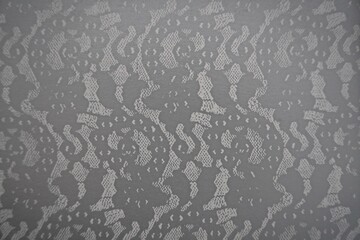 Silver lace design and grey tulle design. Geometric mesh pattern, damask print style, floral lacey texture and gray background with space for text. Blank monochromatic backdrop for paper, card, etc.