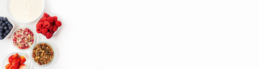 Ingredients for a healthy breakfast. Muesli, berries and yogurt. Healthy eating. Sports fitness menu. Concept. Banner. High quality photo