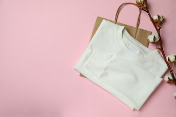 White sweatshirt, bag and cotton on pink background