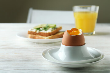 Concept of tasty breakfast with boiled egg, space for text