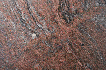 Brown, red, gray granite texture. Stone background. Polished natural granite slab. Rock texture.