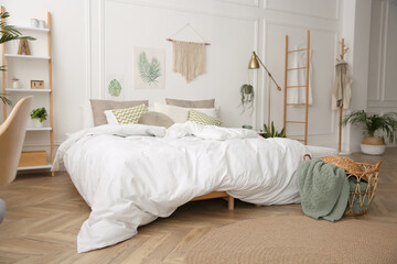 Modern bedroom with beautiful fresh house plants