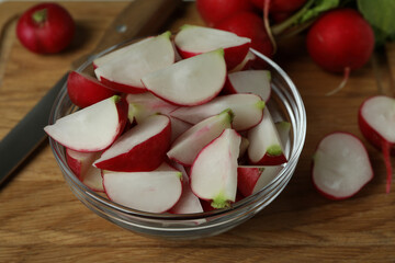 Cutting board with fresh radish, close up