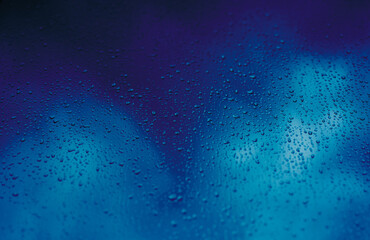raindrops on a blue background. Wallpaper for telephones and computers.