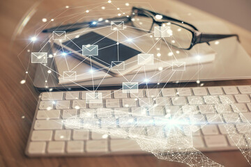 Double exposure of envelope sketch over cell phone background. Concept of sms