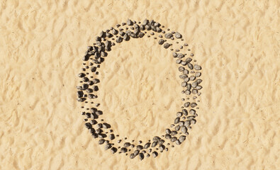 Concept or conceptual stones on beach sand handmade symbol shape, golden sandy background, sign of O. 3d illustration metaphor for education, nature, summer, sunny, seaside and tropical