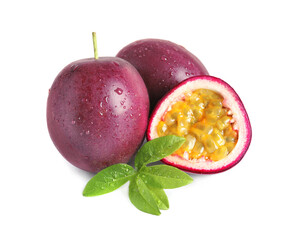 Cut and whole passion fruits with leaf isolated on white