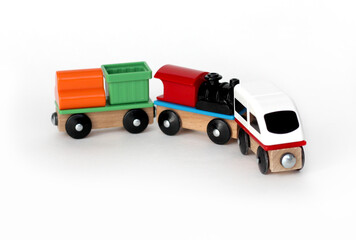 children's toy multicolored paravozik with carriages on a white background