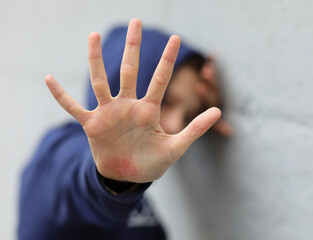 open hand of the young girl who tries to protect herself from violence