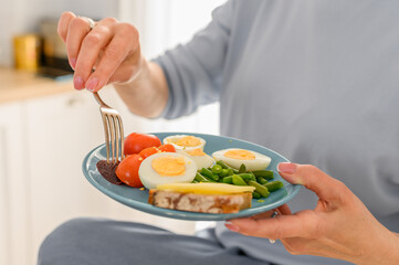 Still life female hans holds Healthy food on plate, balanced breakfast concept. Nutrition planning.