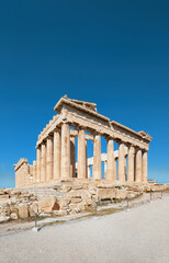 Parthenon temple on a bright day with blue sky. Panoramic image taken in Acropolis hill in Athens,...