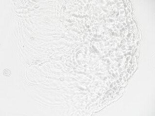 Water background. White transparent water texture, off white water surface with rings and ripple....