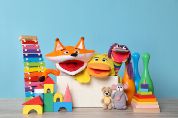 Collection of different toys on white wooden table