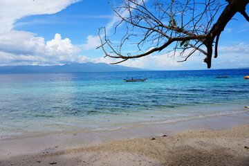 magnificent beach in tropical country decorated with white sandy beach and the blue sky