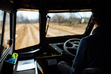 view from the interior of the SUV on the off-road. travel through the wild places by car with high traffic. view from the passenger seat to the driver's seat