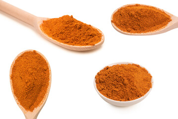 Paprica on wooden spoon isolated.