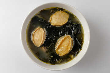 Abalone seaweed soup on a white background