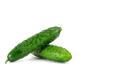 Green cucumbers on white background