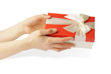 gift in hands isolated on white. female hands holding a red box with a white ribbon and a bow.