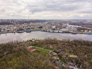 Fototapeta premium Dnieper river in Kiev in the afternoon. Aerial drone view.