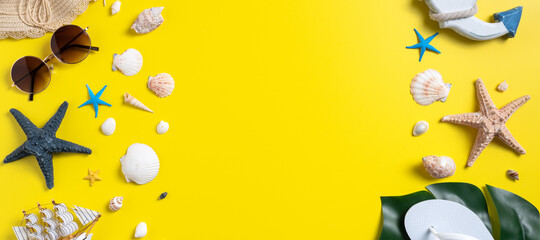 Summer beach design concept with shells, hat, slipper on yellow background.