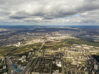 Fototapeta premium The city of Kiev in cloudy weather. Aerial high view.