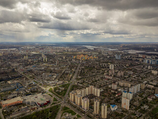 Fototapeta premium The city of Kiev in cloudy weather. Aerial high view.