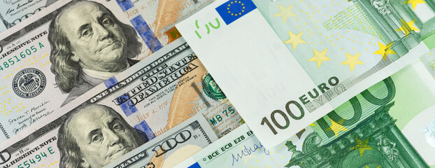 Dollar euro banner background banknotes of hundred bills. American US and European EU cash