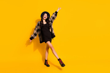 Obraz premium Photo of inspired lady dance enjoy wear hat checkered coat mini dress footwear isolated yellow color background