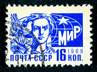 stamp printed in the CCCP shows a woman and a pigeon