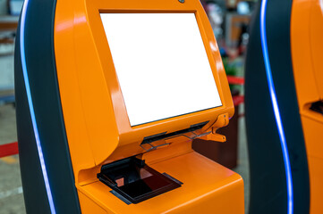 mockup airport self check-in device with blank white screen. Self service machine and help desk...