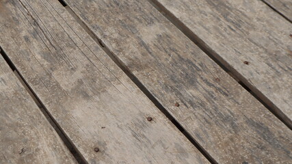 Fototapeta na wymiar Natural wooden pier texture backgroud. Wooden pier plank background. Warm color of wooden panels on the floor.