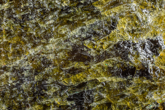 Mineral diopside. A structure of a rock on fracture close-up