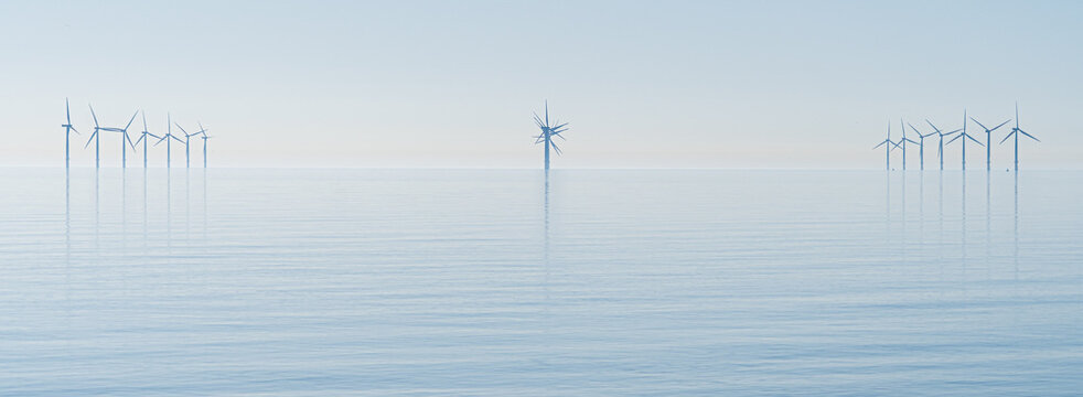 Offshore wind turbines generating renewable electricity and energy off the Essex clacton coast for eco backdrop, texture, wallpaper shiloutted against clear sky background