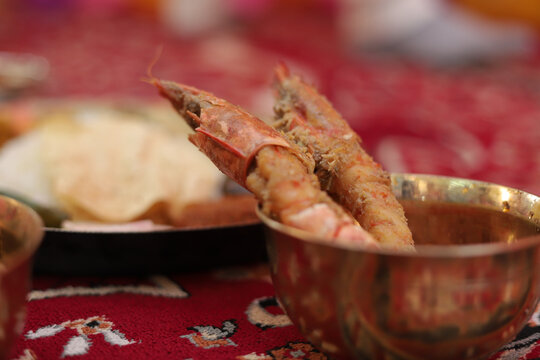 Closeup of a bowl of delicious Indian prawn curry on the table