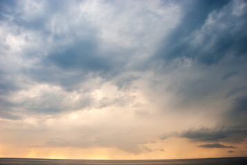 Beautiful storm clouds against the backdrop of sunset skies.