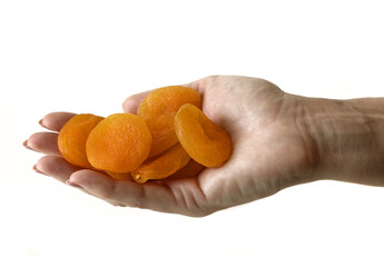 handful of dried apricots in a hand