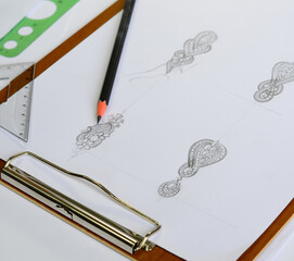 The sketch is designing jewelry earrings.