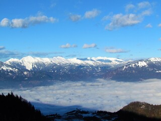 View of Karavanke mountains, Gorenjska, Slovenia and fog covering the landscape bellow