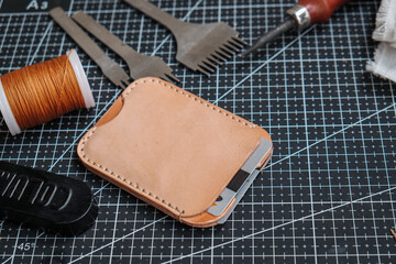 Leather money card wallet craftmanship working with leather tool on board