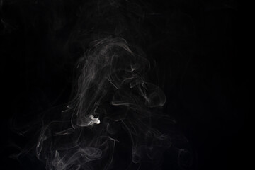 cloud of white smoke on black background
